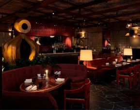 The Standard, London’s Decimo Restaurant, with hard floor and low-lit atmosphere for diners.