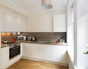 The Hammersmith One’s kitchen, including kettle, oven, microwave, and toaster.