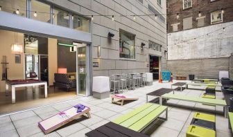 The hotel’s patio area, with plentiful seating and tall stools/tables.