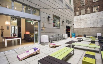 The hotel’s patio area, with plentiful seating and tall stools/tables.