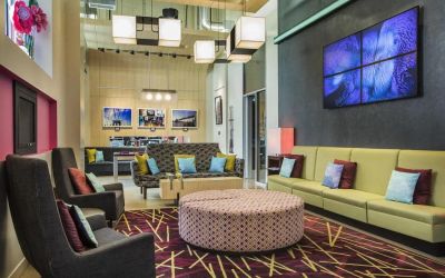 The hotel’s lounge, with comfortable chairs and sofas, and many cushions.