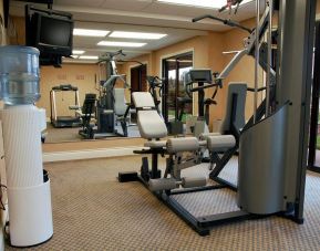 Comfort Inn Fredericton’s fitness center has multiple exercise machines and an overhead TV.