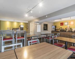 The hotel’s breakfast dining area has a range of table sizes and both standard and tall chairs.