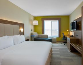 Spacious delux king room with TV and work desk at Holiday Inn Express & Suites Ontario.