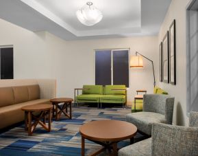 Comfortable lobby and coworking space at Holiday Inn Express & Suites Ontario.