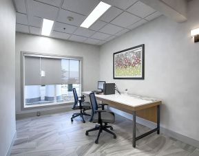 Dedicated business center with PC, internet, printer, and work space at Holiday Inn Express & Suites Airport-Calgary.