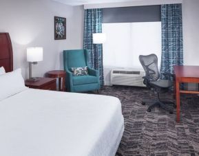 Spacious king suite with TV and business desk at Hilton Garden Inn Dallas/Allen.