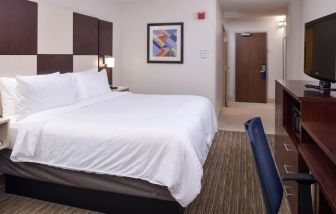 Delux king bed with TV and business desk at Holiday Inn Express Towson Baltimore N.