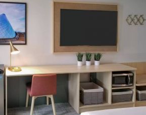 An in-room workspace at the Hotel Thea - Ascend Collection, with desk and chair.