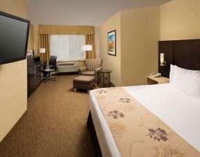 Spacious king bedroom with work station at Best Western Seattle Airport Hotel.