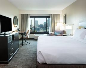 Spacious king bedroom with TV and work station at Crowne Plaza Memphis Downtown.