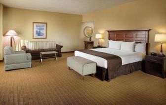 Spacious king bedroom with work station at Doubletree Hotel Chicago O'Hare Airport-Rosemont.