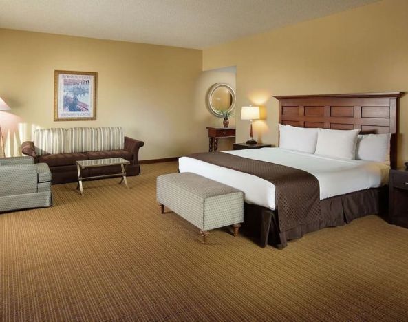 Spacious king bedroom with work station at Doubletree Hotel Chicago O'Hare Airport-Rosemont.