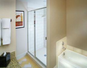 Private guest bathroom with shower at Doubletree Hotel Chicago O'Hare Airport-Rosemont.