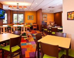 Comfortable dining and coworking space at Fairfield Inn & Suites Houston Hobby Airport.