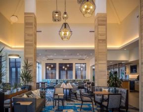 Comfortable dining and coworking space at Hilton Garden Inn Pittsburgh Airport.