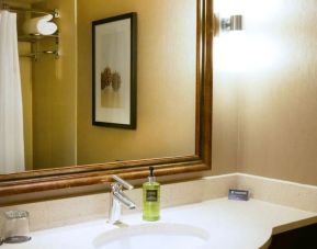 Private guest bathroom with shower at Pacific Gateway Hotel Vancouver Airport.