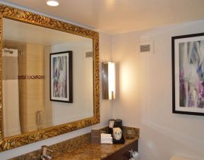 Private guest bathroom with shower at Pullman Miami Airport.