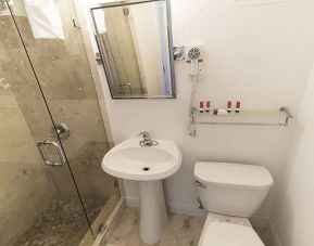 Private guest bathroom with shower at The Broadmore Miami Beach.