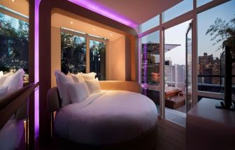 Delux king bed with TV at YOTEL New York.