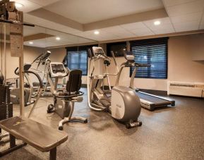 The fitness center has a variety of exercise machines for guests.