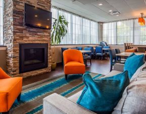The hotel’s lobby lounge has comfy seating and a widescreen television.