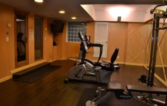 The hotel fitness center has exercise machines and a television.