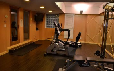 The hotel fitness center has exercise machines and a television.