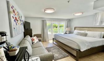 Comfortable delux king with couch at Skylaranna Hotel and Resort.