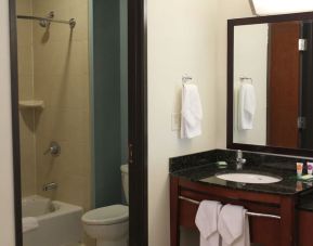 Private guest bathroom with shower at Hyatt Place Dallas Garland.