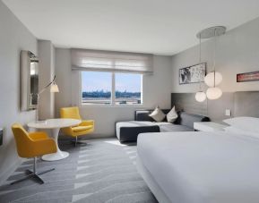 Delux king bed with TV and business desk at Hyatt Regency at Los Angeles International Airport.