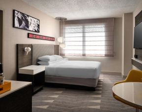 Spacious king bedroom with TV at Hyatt Regency at Los Angeles International Airport.