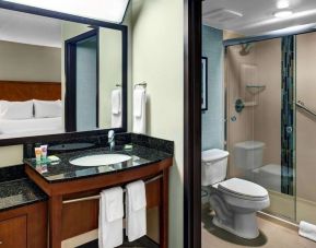 Private guest bathroom with shower at Hyatt Place Albuquerque Airport.