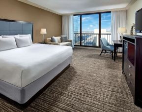 Delux king bed with TV and business desk at Hyatt Regency Tulsa.