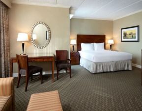 Delux king bed with TV and business desk at Hyatt Regency Houston West.