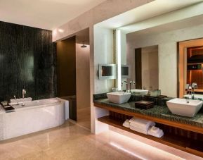 Private guest bathroom with shower at Park Hyatt Abu Dhabi Hotel & Villas.