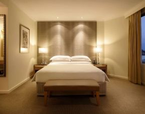 Spacious king bedroom with TV at Hyatt Regency Perth.