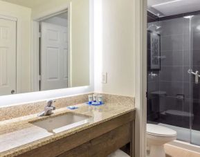 Private guest bathroom with shower at Hyatt House Houston / Galleria.