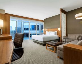 Delux king bed with TV and business desk at Hyatt Place Chicago Downtown/The Loop.