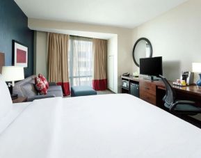 Spacious king bedroom with TV and work space at Hyatt Place DC Georgetown West End.