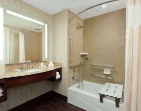 Private guest bathroom with shower at Hyatt Place DC Georgetown West End.