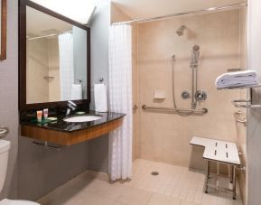 Private guest bathroom with shower at Hyatt Place New York Midtown South.