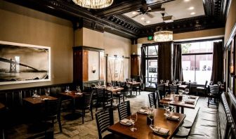 The hotel’s adjoining restaurant offers tables for two or four diners in a stylish, well-lit setting.