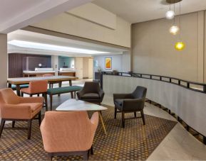 The hotel’s lobby lounge offers comfortable seating and coffee tables.