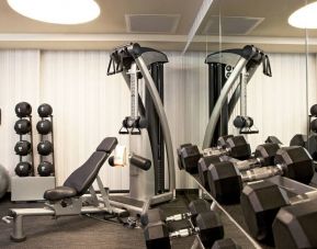 The Hotel 48LEX New York’s fitness center, with weights and exercise machinery.