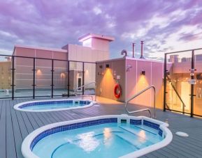 Relaxing rooftop hot tubs at Hotel Clique Calgary Airport.