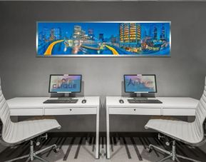 Dedicated business center with PC, internet, and printer at Hotel Clique Calgary Airport.