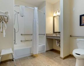 Guest bathroom with bath and shower combo at Comfort Suites Alexandria, LA.