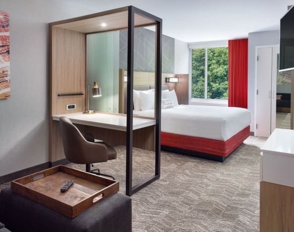 Spacious king room with TV and business desk at SpringHill Suites Atlanta Northwest.