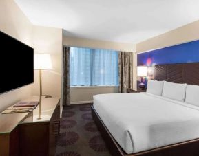 Comfortable delux king room with TV at The Chicago Hotel Collection - Magnificent Mile.